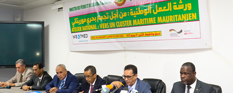panel of speakers sitting at a table during the westmed in my country 22 event in Mauritania