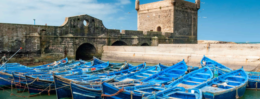 blue fishing boats in small port morocco