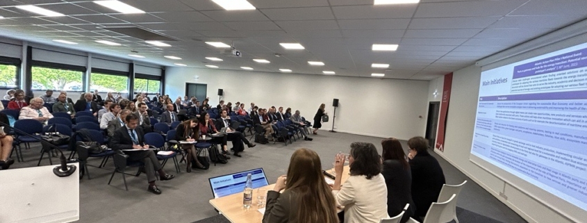 EMD 2023 decarbonisation workshop by the joint sea basin assistance mechanism - speakers plus audience in conference room