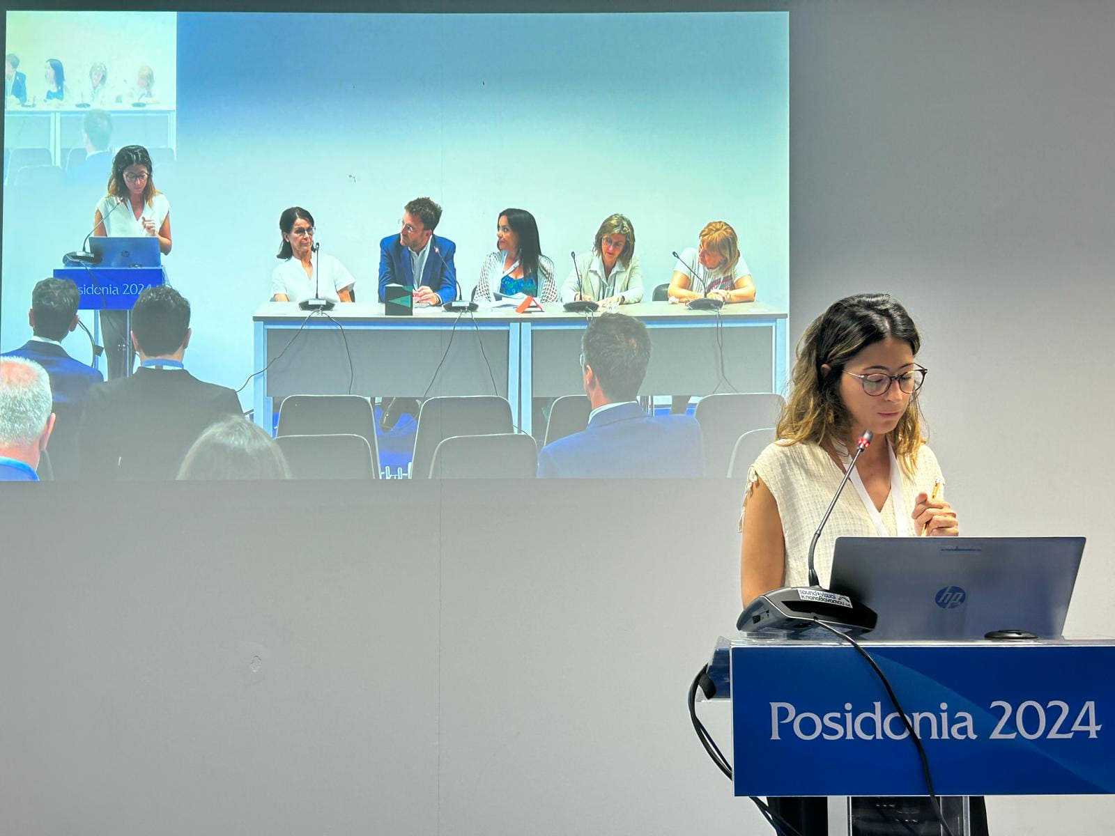 Adriana Salazar from the UfM at Posidonia 2024 with speakers panel in background