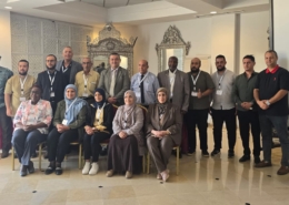 Group picture with people posing at workshop